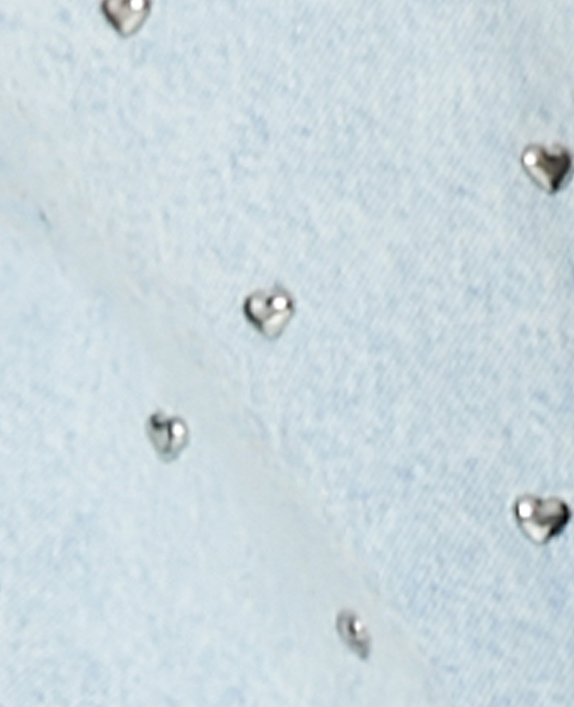 Veste en jean avec cœurs métalliques