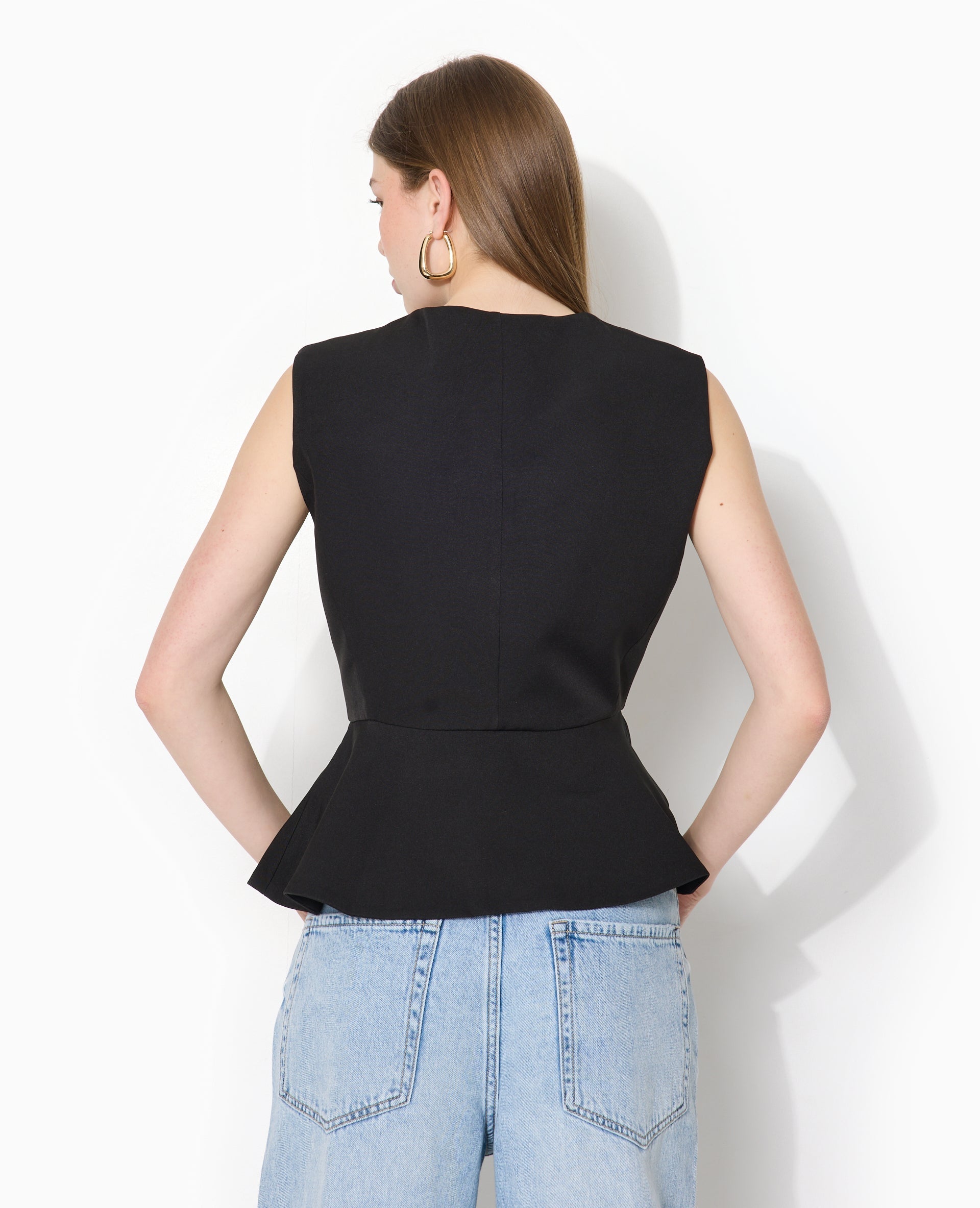 Veste sans manches peplum avec boutons fantaisie