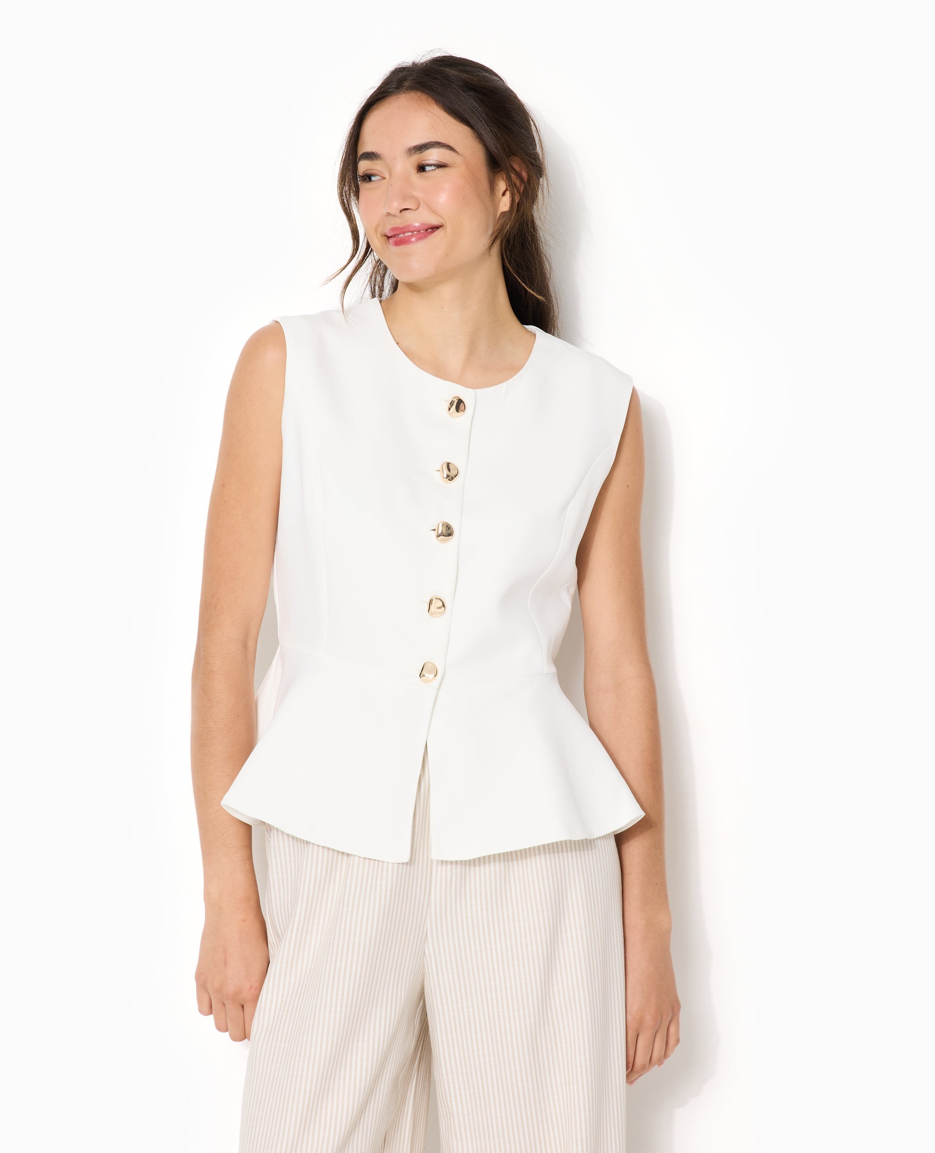 Veste sans manches peplum avec boutons fantaisie