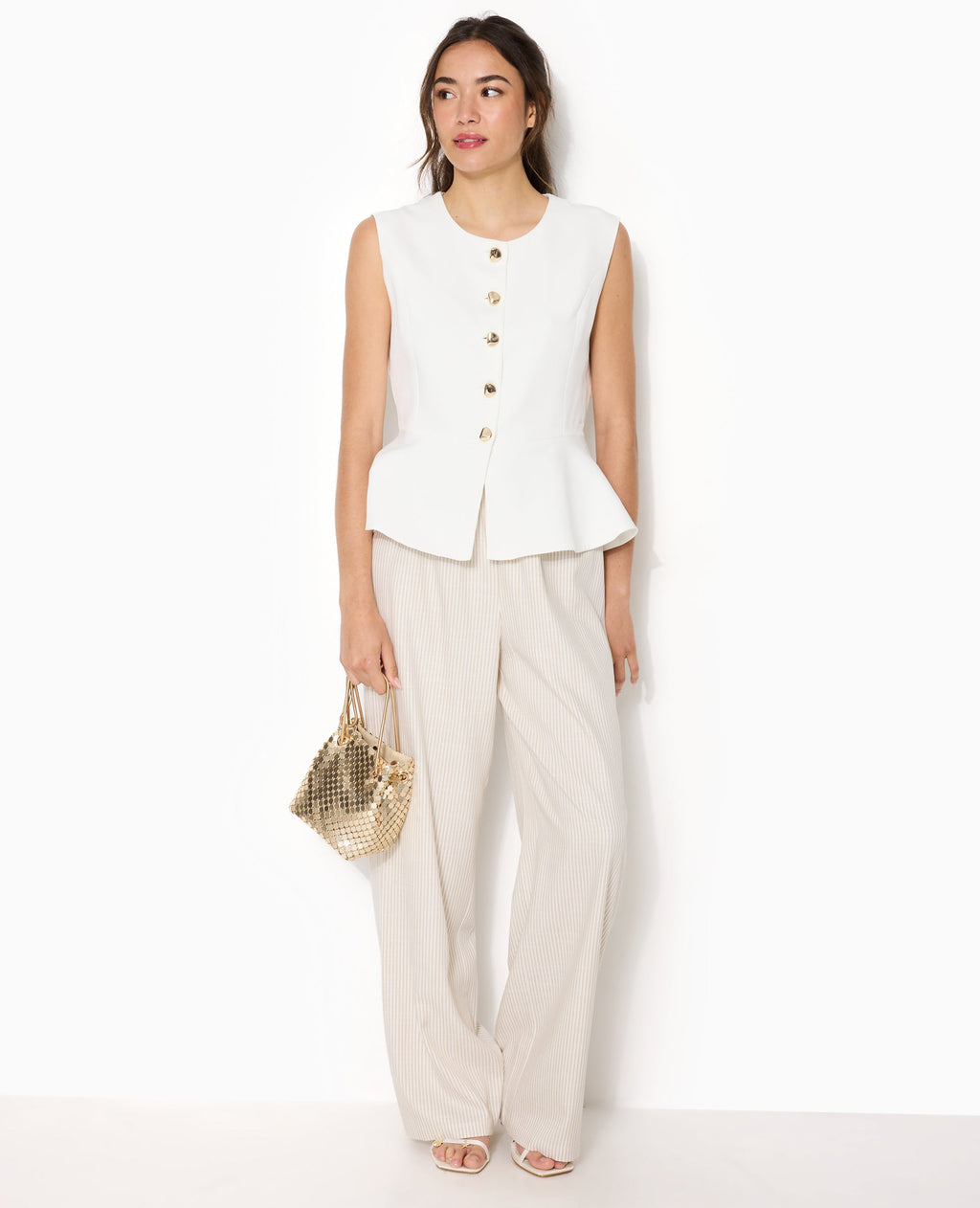 Veste sans manches peplum avec boutons fantaisie