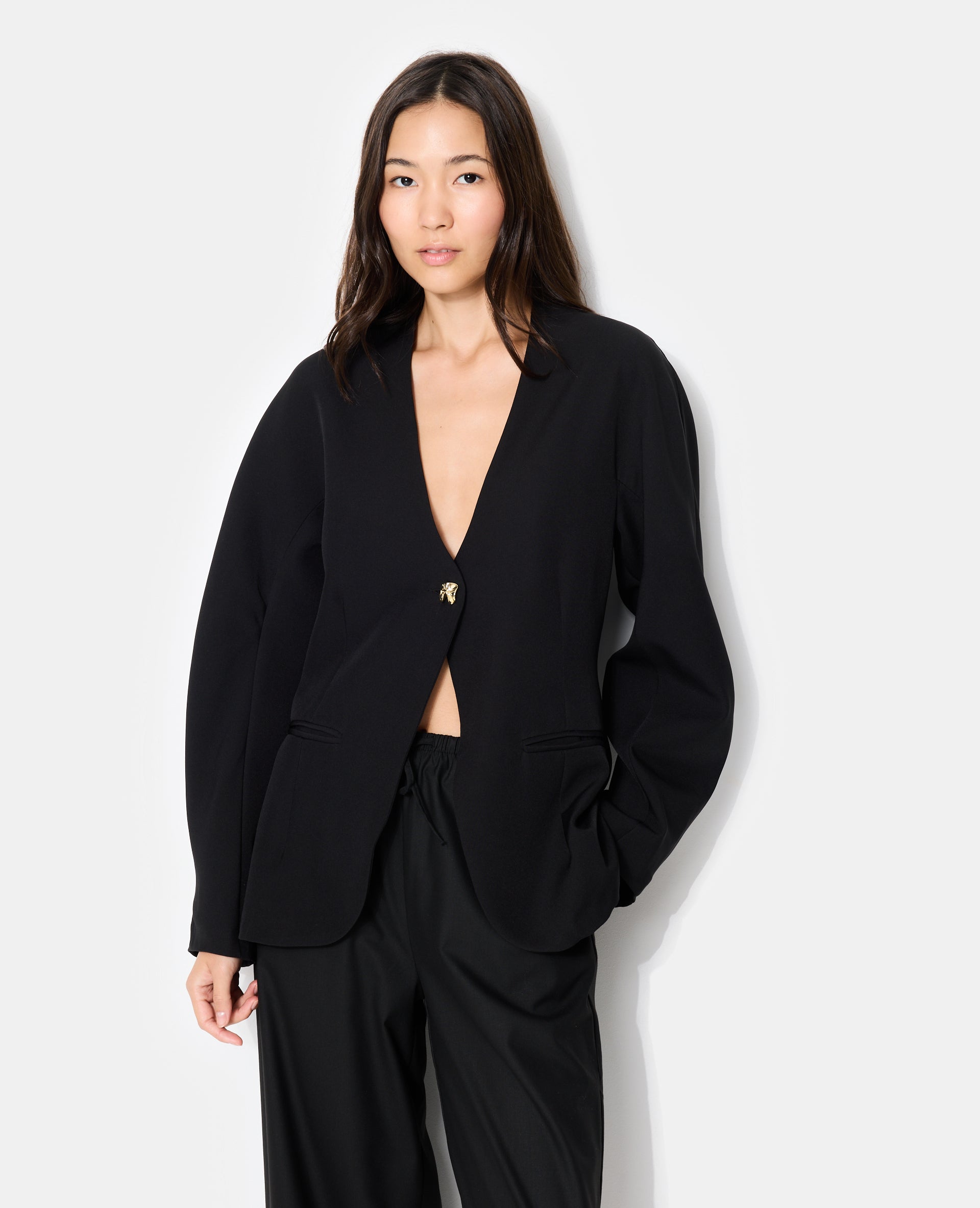 Veste blazer cintrée avec manches bouffantes