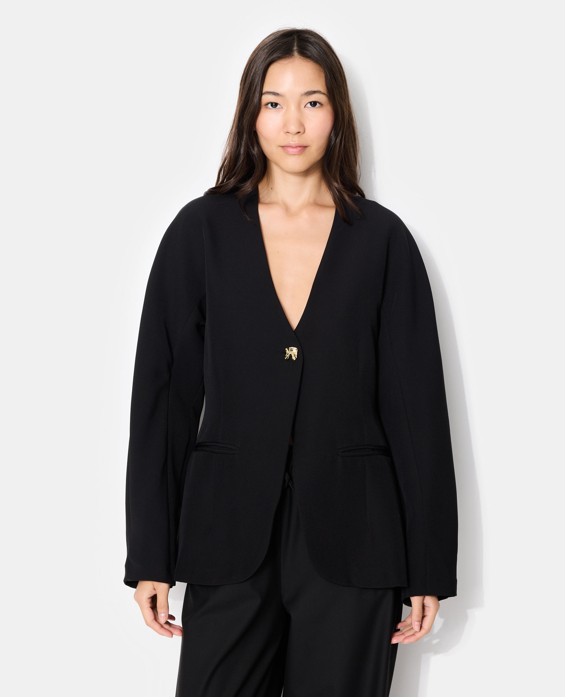 Veste blazer cintrée avec manches bouffantes