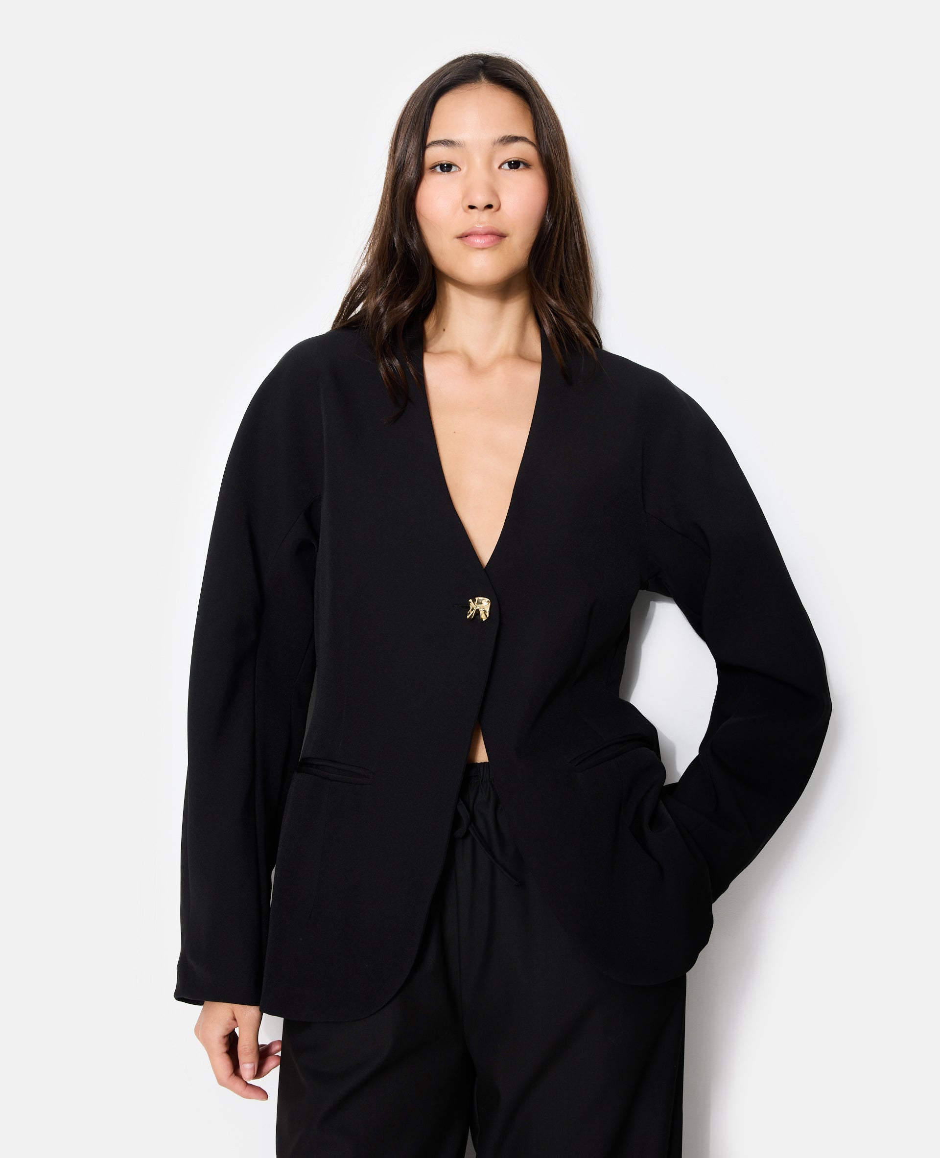 Veste blazer cintrée avec manches bouffantes