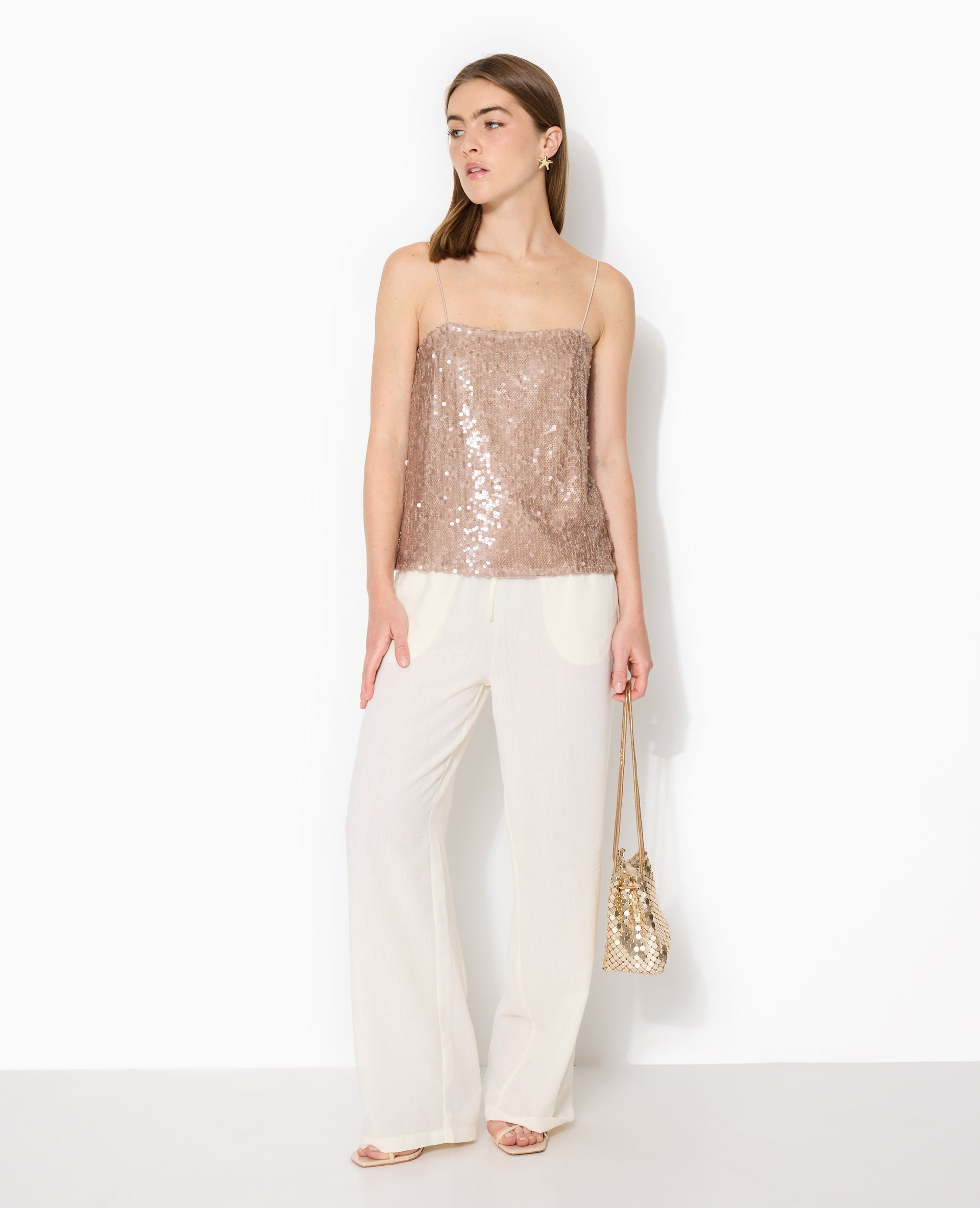 Top dos ouvert en maille ajourée avec sequins