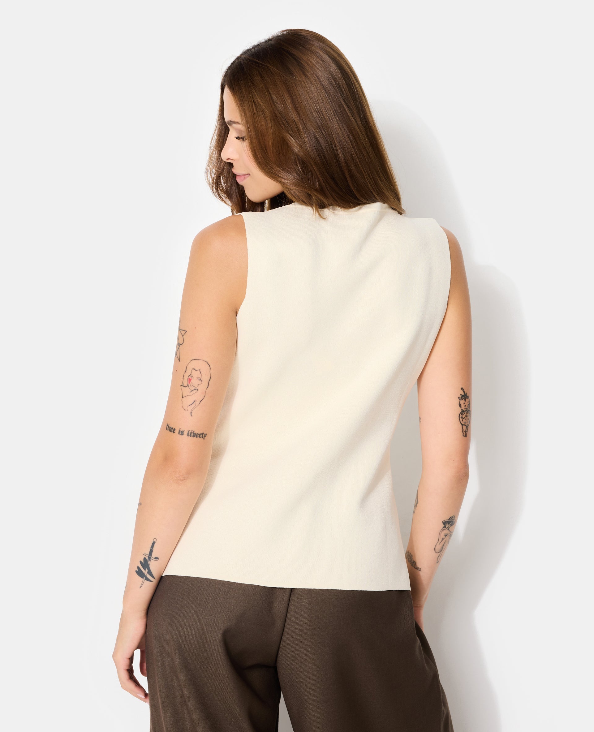 Gilet sans manches avec boutons fantaisie