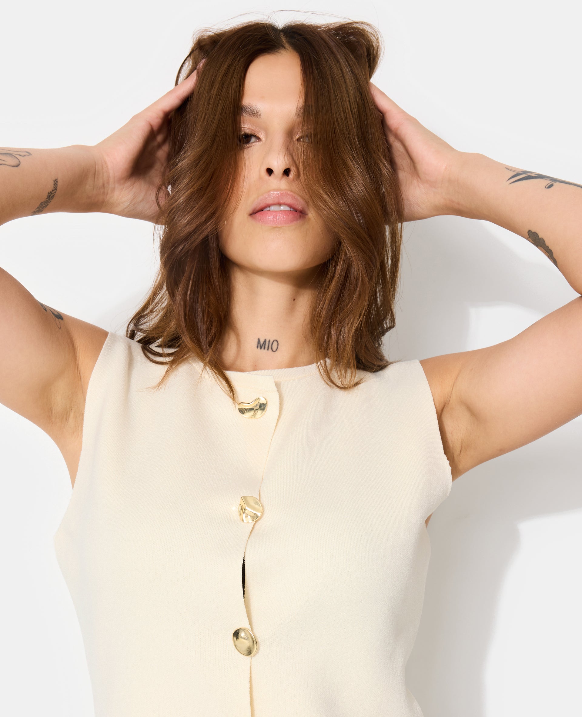 Gilet sans manches avec boutons fantaisie