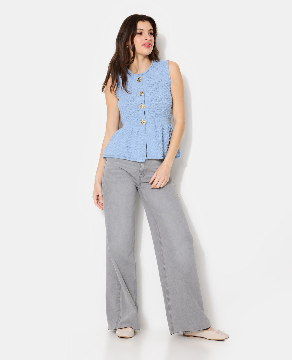 Gilet sans manches peplum avec boutons fantaisie