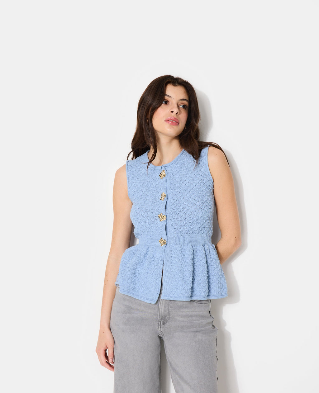 Gilet sans manches peplum avec boutons fantaisie