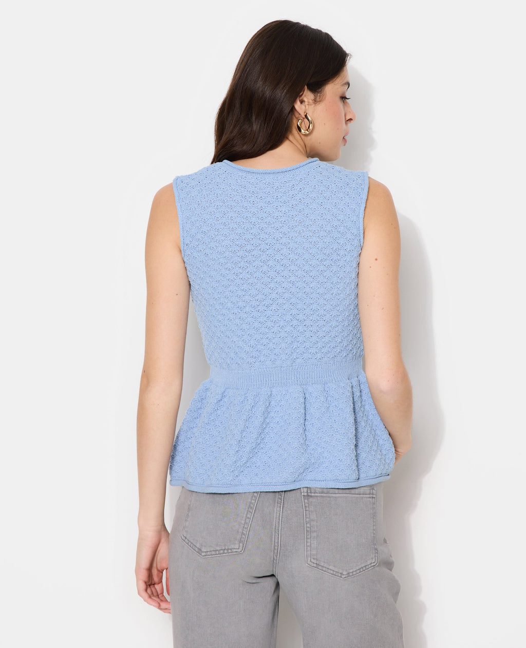 Gilet sans manches peplum avec boutons fantaisie