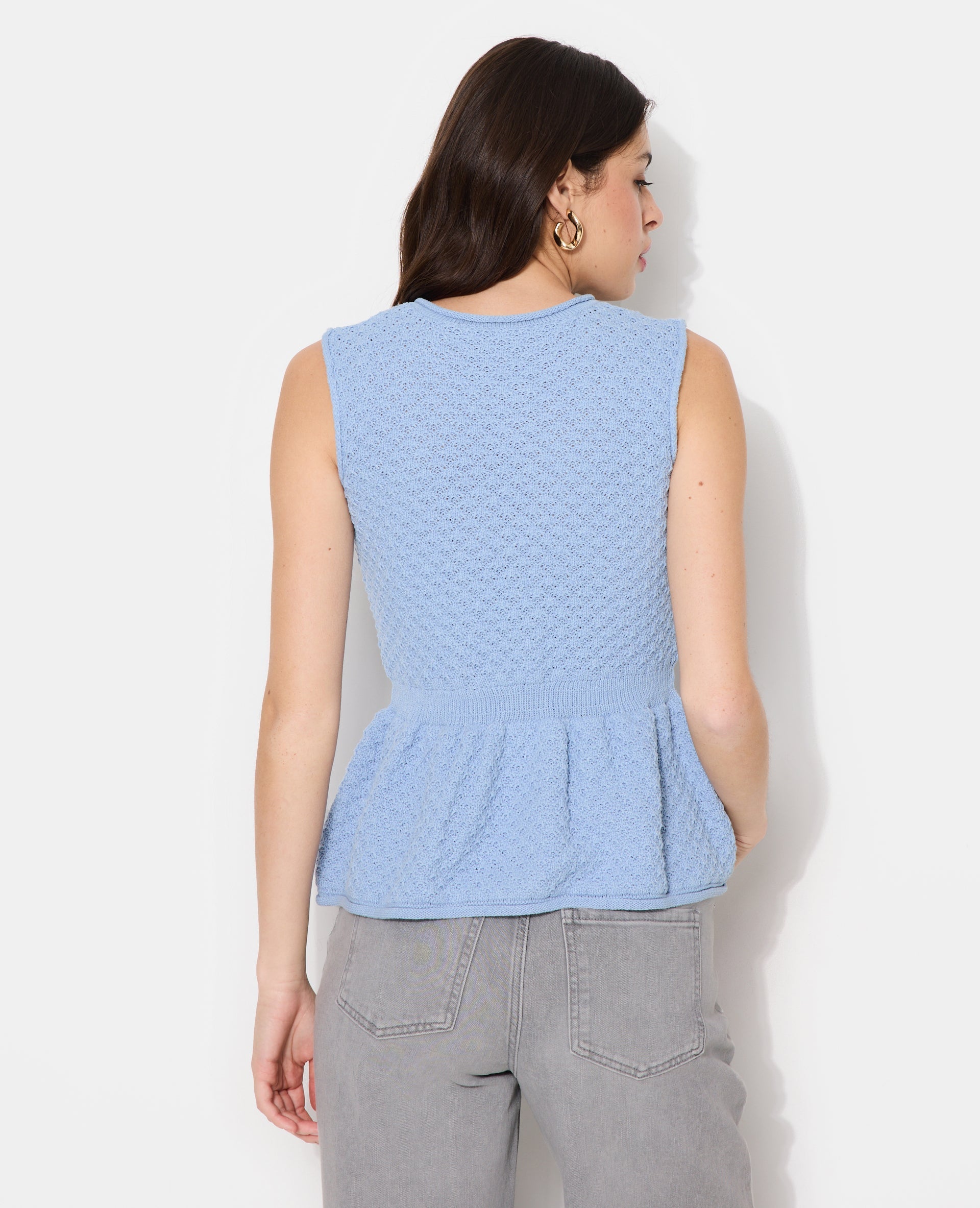 Gilet sans manches peplum avec boutons fantaisie