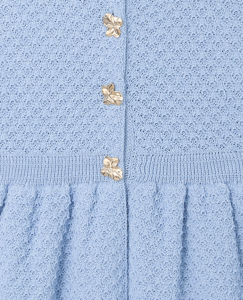 Gilet sans manches peplum avec boutons fantaisie