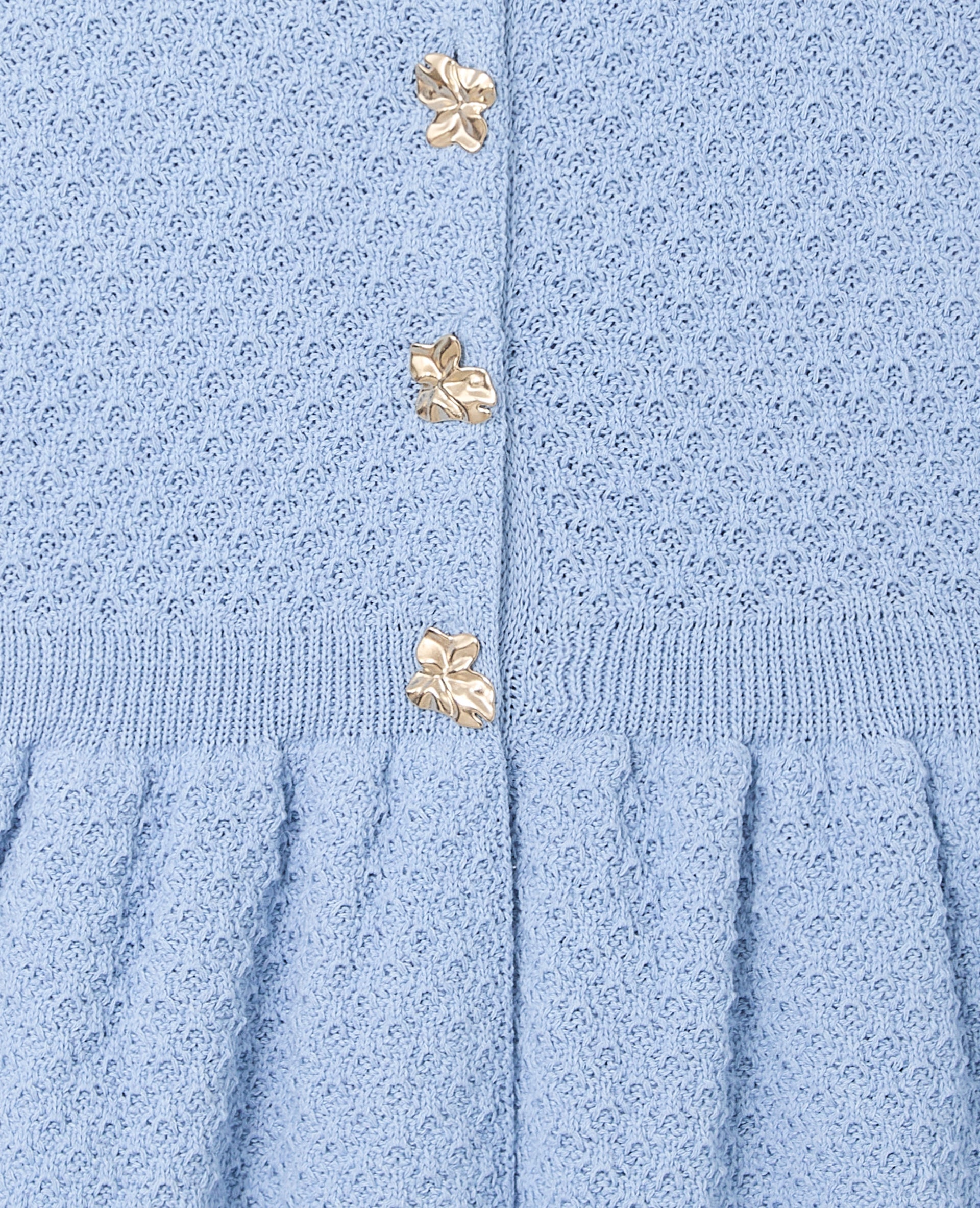Gilet sans manches peplum avec boutons fantaisie