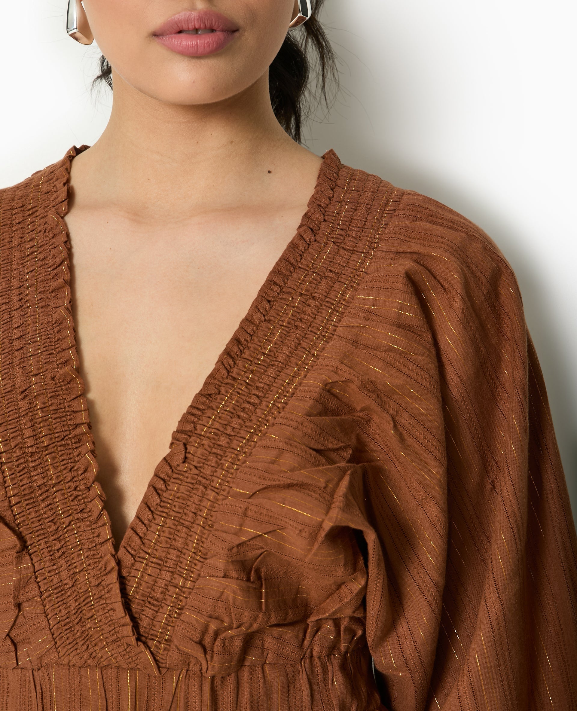Blouse décolletée avec manches chauve-souris