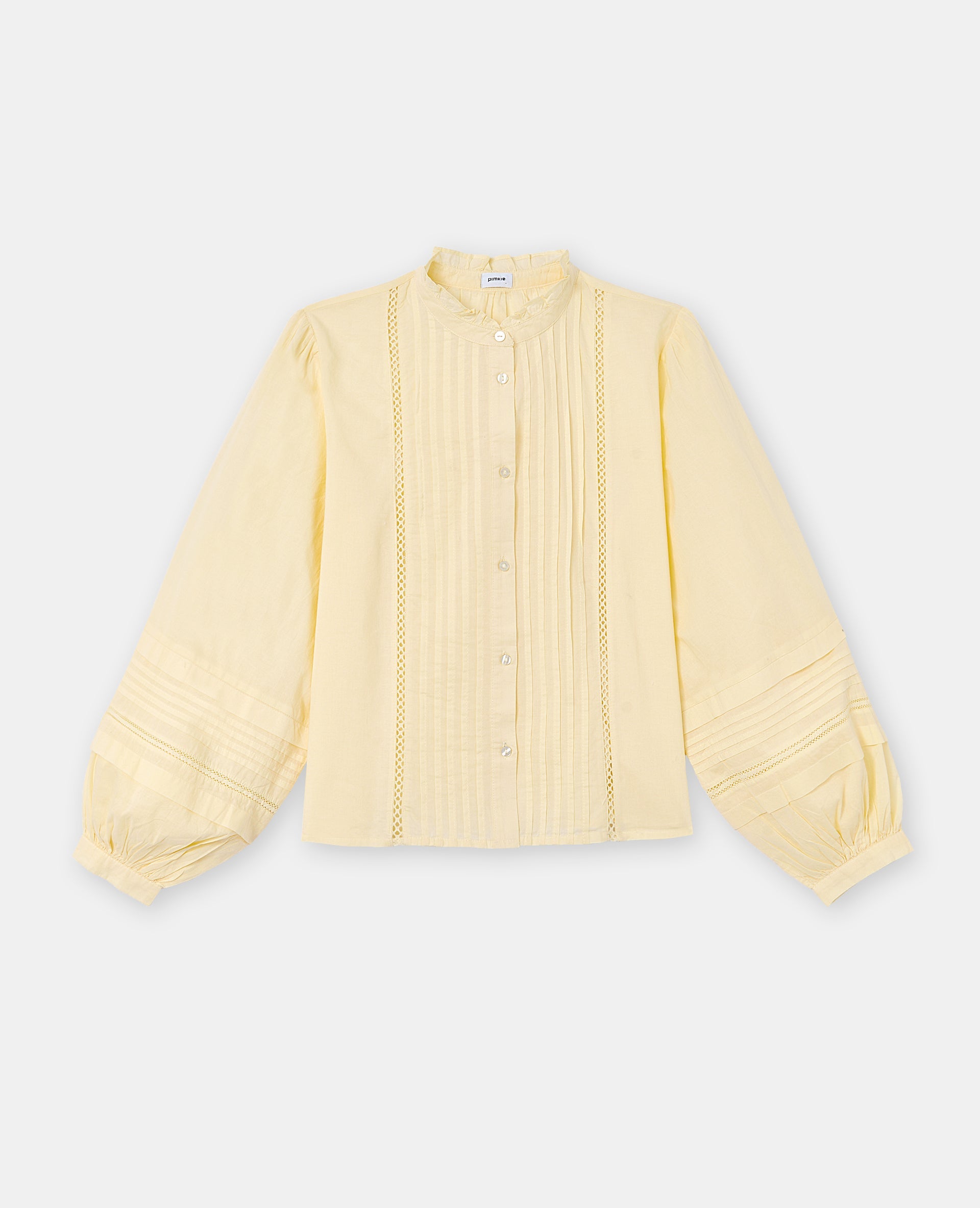 Blouse col volanté avec plis et dentelle