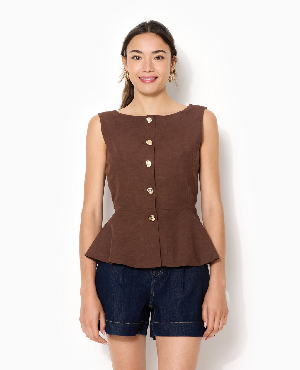 Top sans manches forme peplum avec dos dégagé