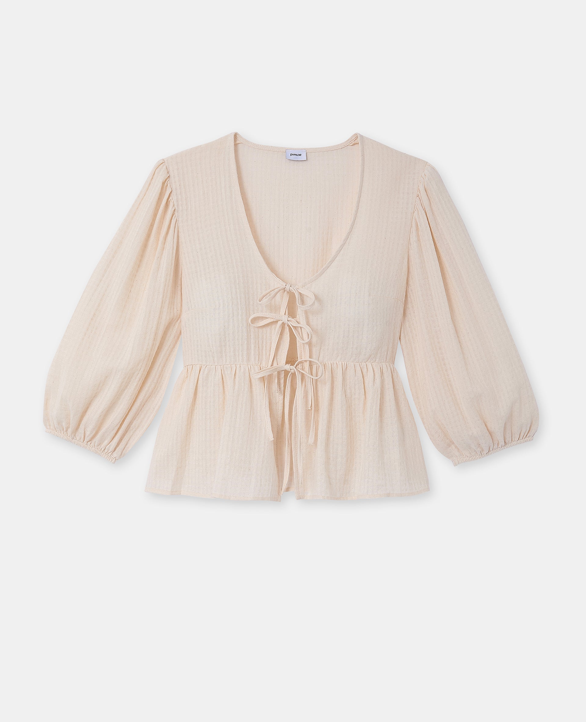 Blouse tissu gaufré avec nouettes et volant