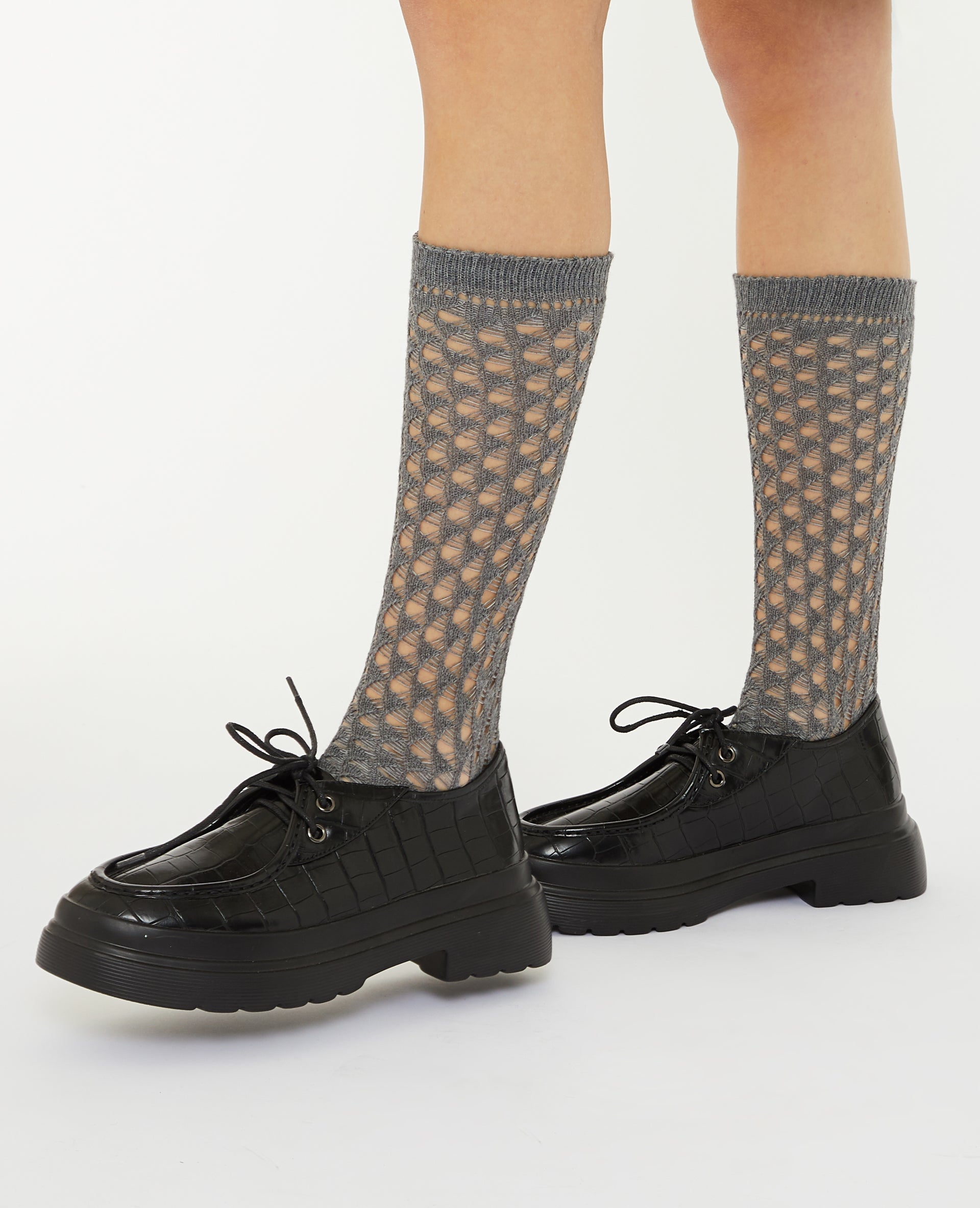 Paire de chaussettes hautes en maille ajourée