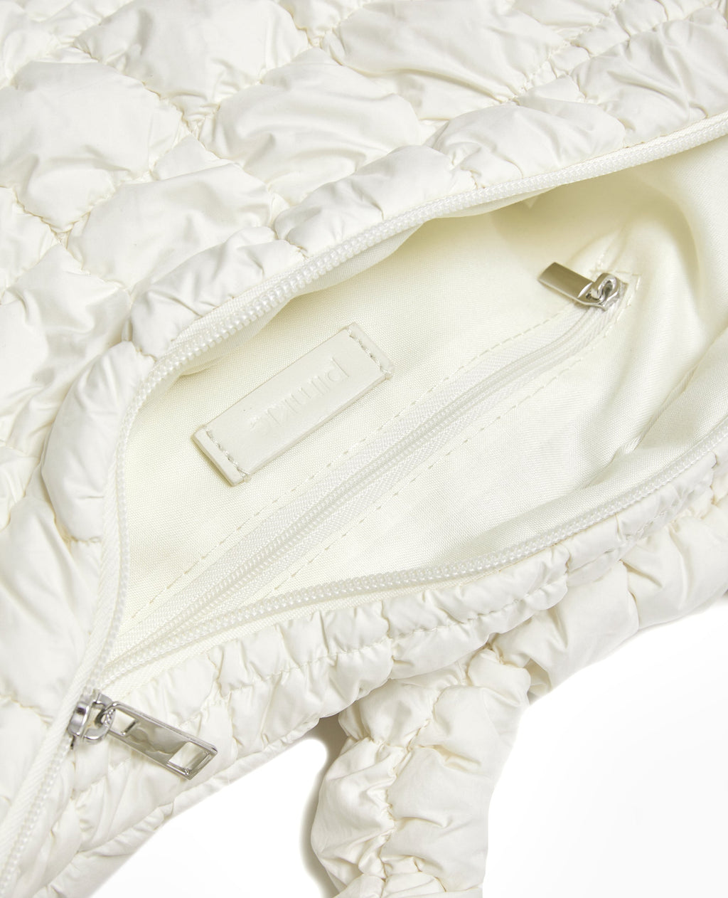 Sac besace en tissu matelassé
