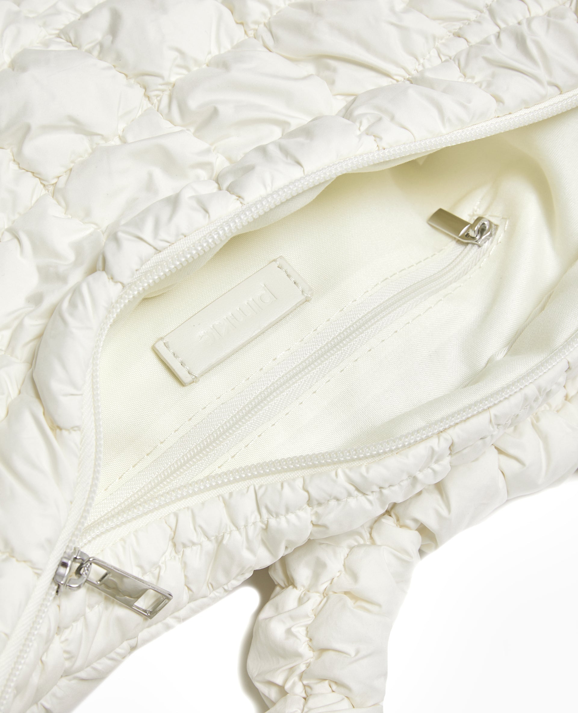 Sac besace en tissu matelassé
