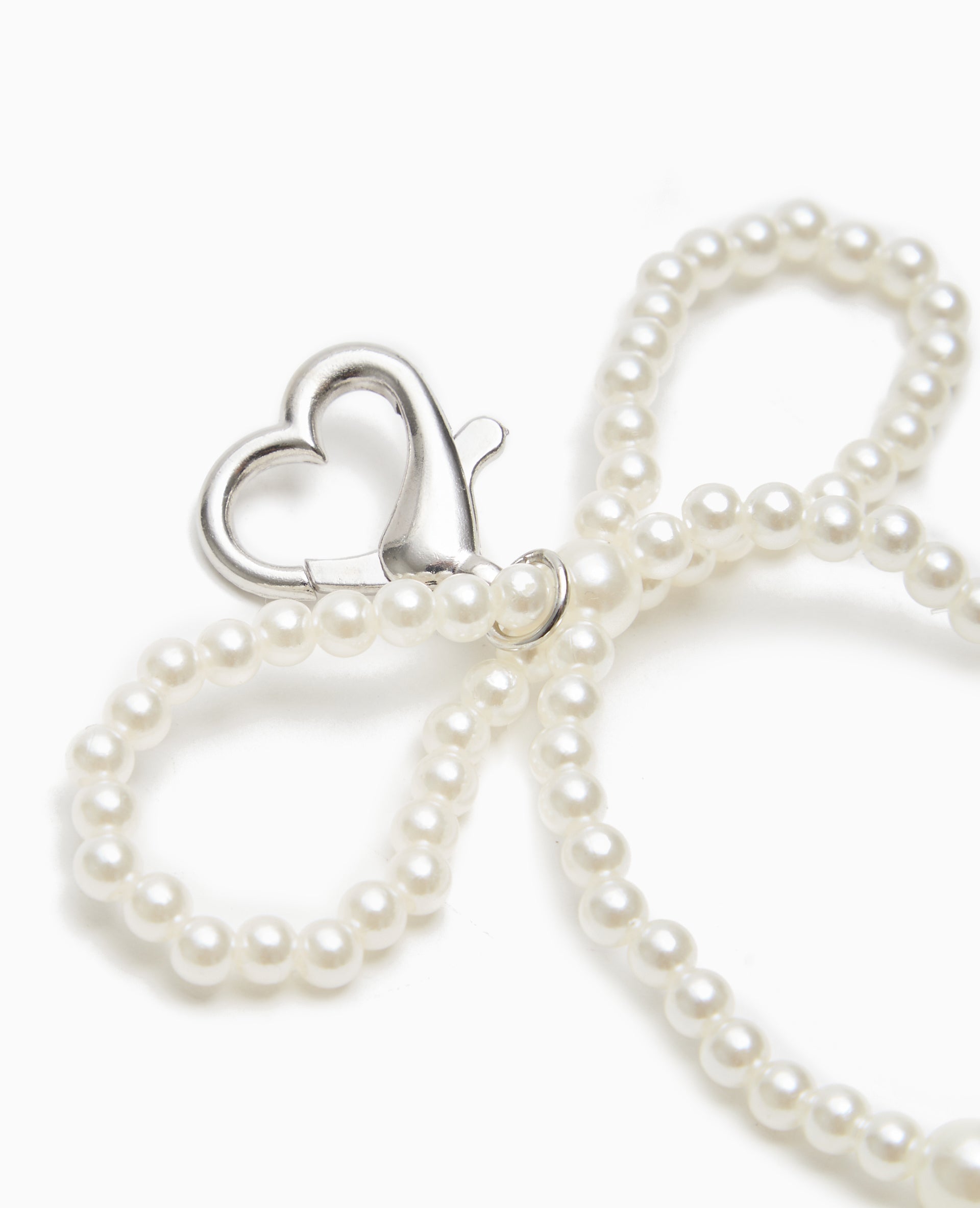 Bijou de sac avec nœud en perles
